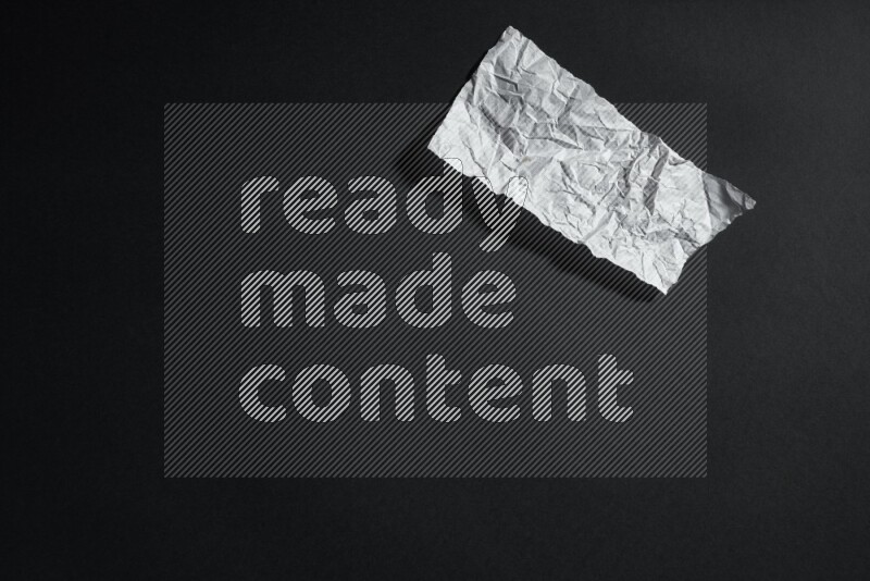 White paper sheet on black background