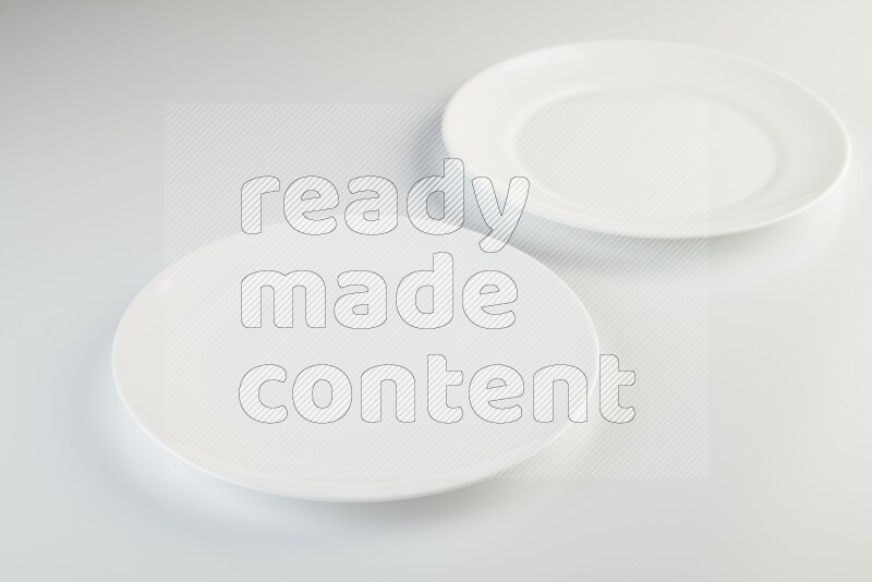 white and black plates on white background