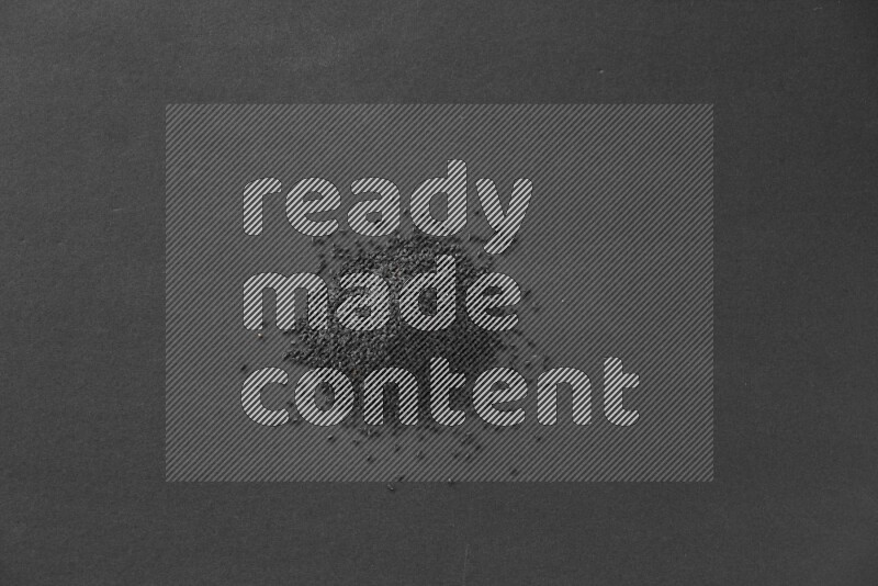 Black seeds on a black flooring