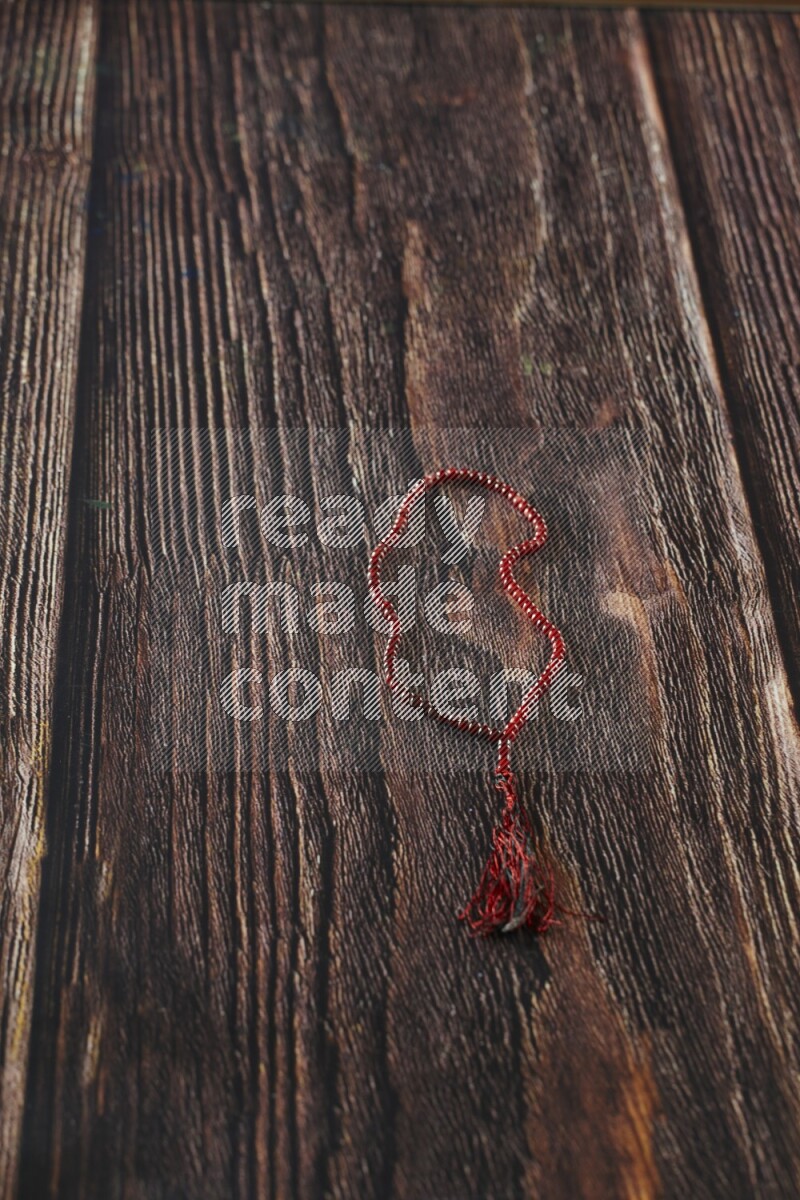 A prayer beads placed on wooden background