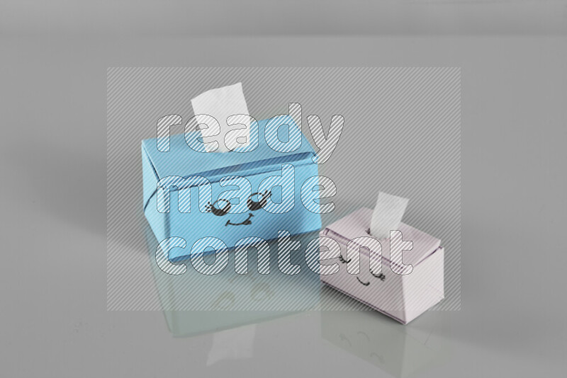 Origami tissue box on grey background