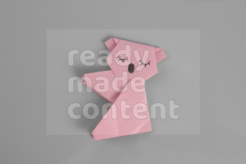 Origami animals on grey background