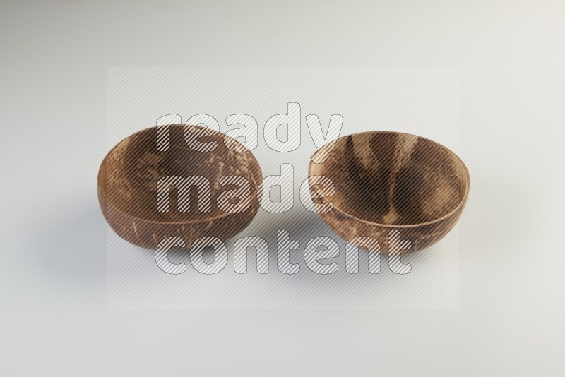 Wooden bowl and plate on white background