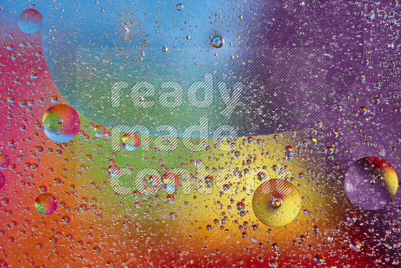 Close-ups of abstract oil bubbles on water surface in multicolors