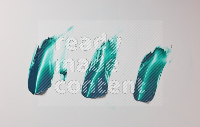 Turquoise painting knife strokes on white background