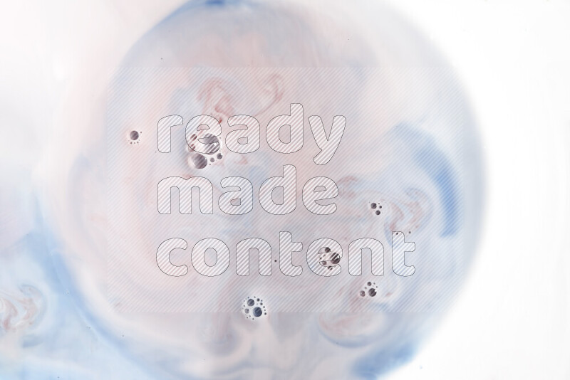 A close-up of abstract swirling patterns in blue, red and white