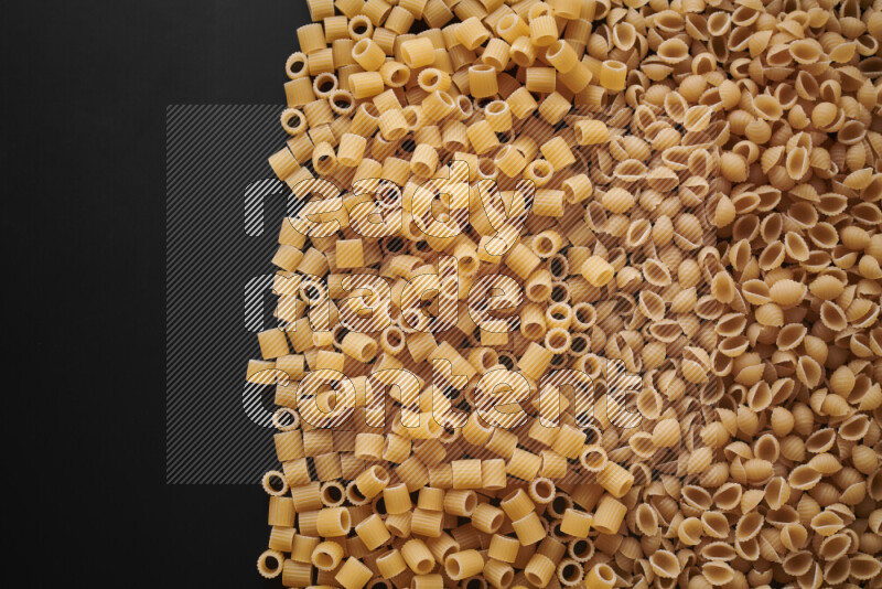 Different pasta types on black background