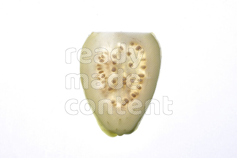 Guava slices on illuminated white background