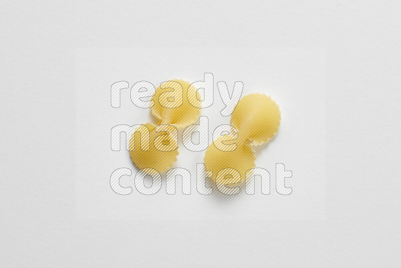 Fiocchi pasta on white background