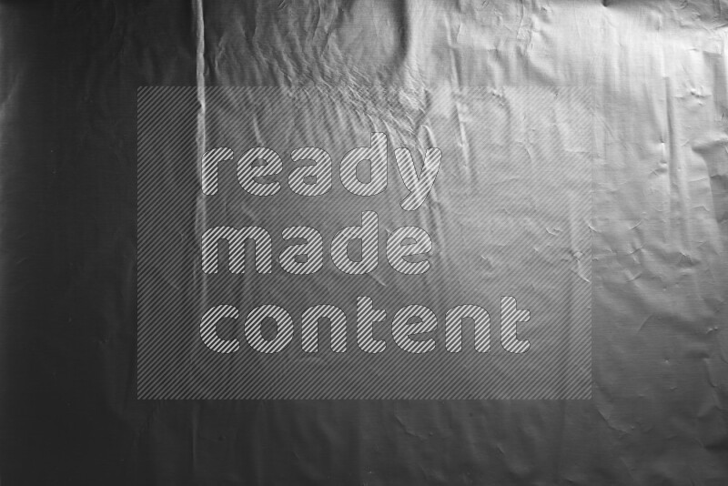 Aluminium foil on black background