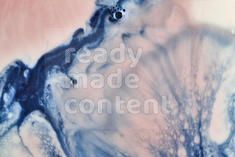 A close-up of abstract swirling patterns in blue, red and white