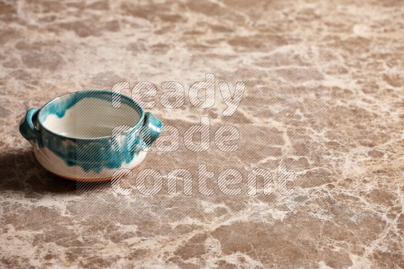 Multicolored Pottery Bowl on Beige Marble Flooring