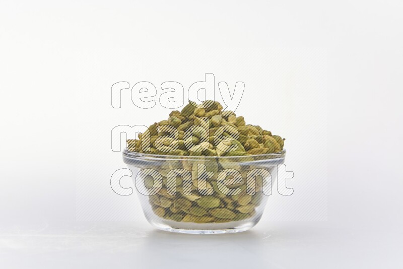 Cardamon in a container on white background