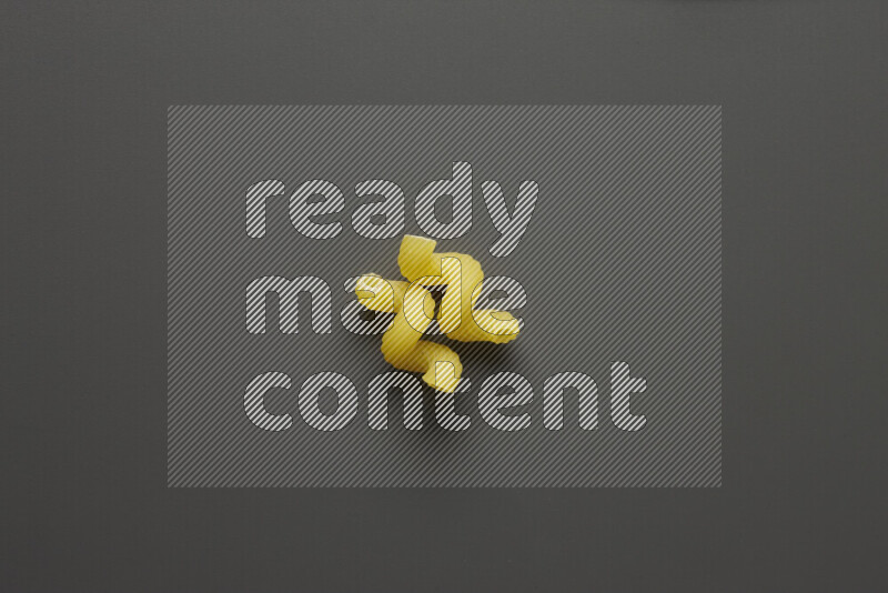 Twist pasta on grey background