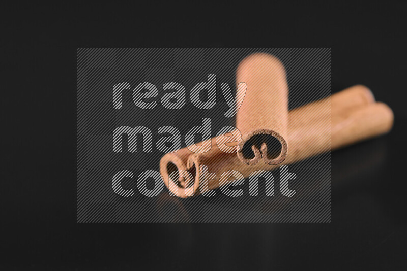 Cinnamon sticks on black background