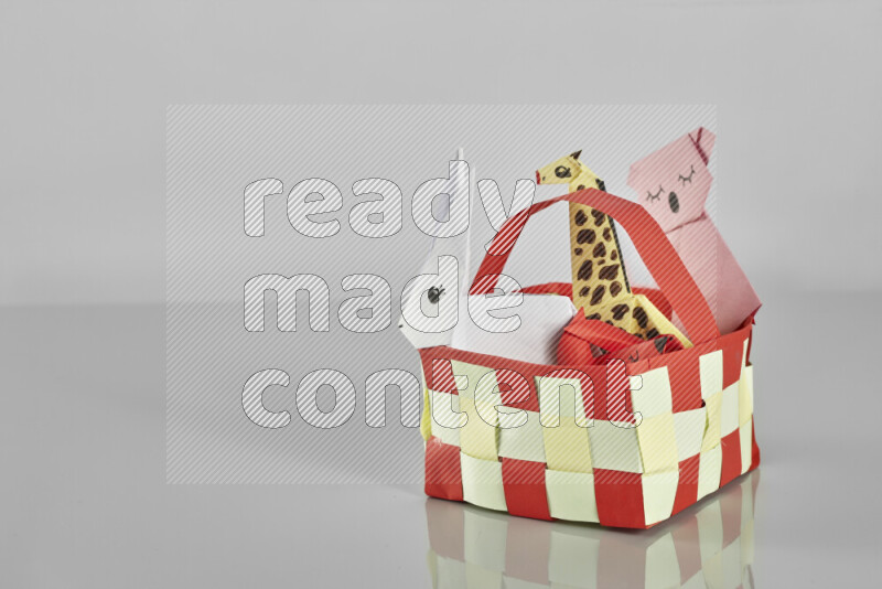 Origami animals on grey background