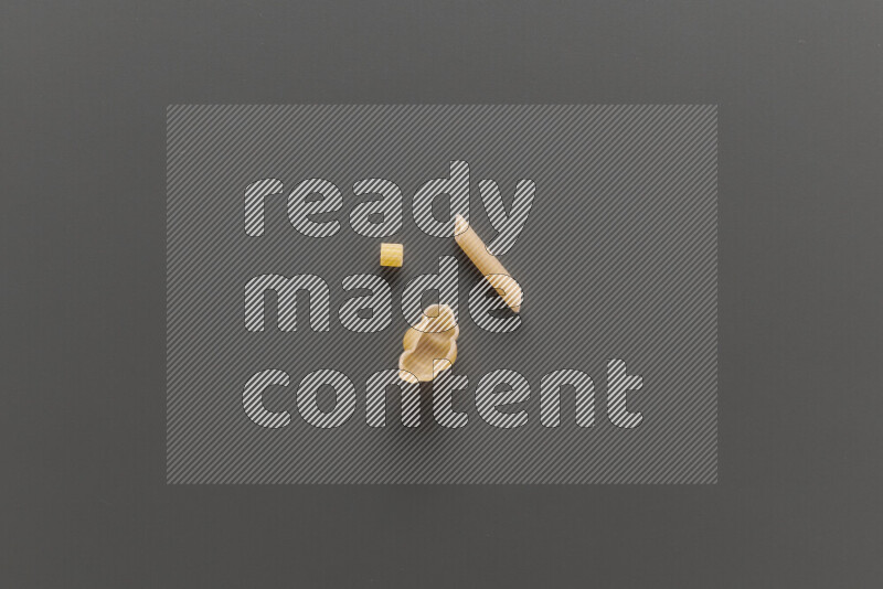 Different pasta types on grey background