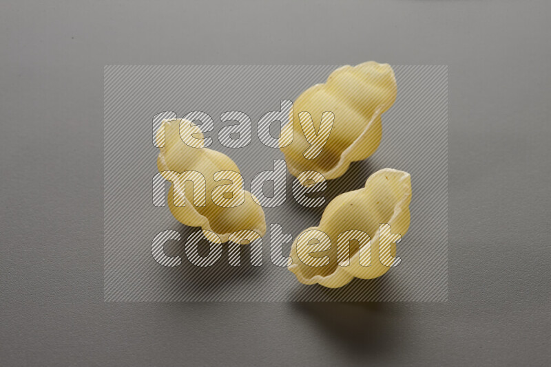 Snails pasta on grey background