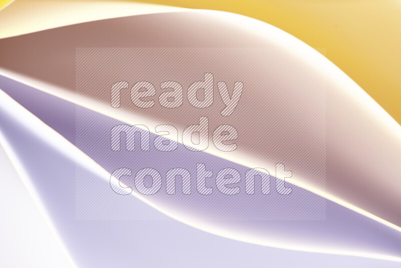 This image showcases an abstract paper art composition with paper curves in white and different warm gradients created by colored light