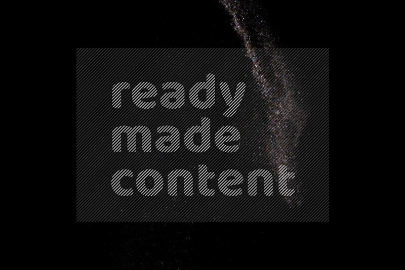 Multicolored glitter powder isolated on black background