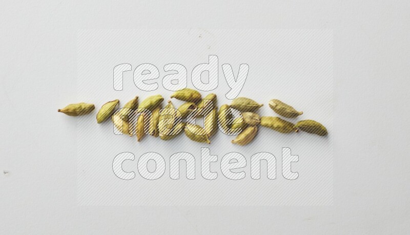 Top-view shot of Cardamon on white background