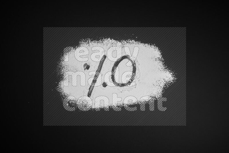Percentages written with powder on black background