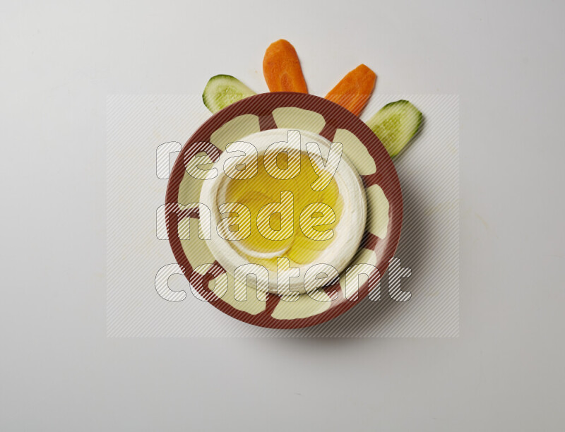 Lebnah garnished with olive oil in a traditional plate on a white background