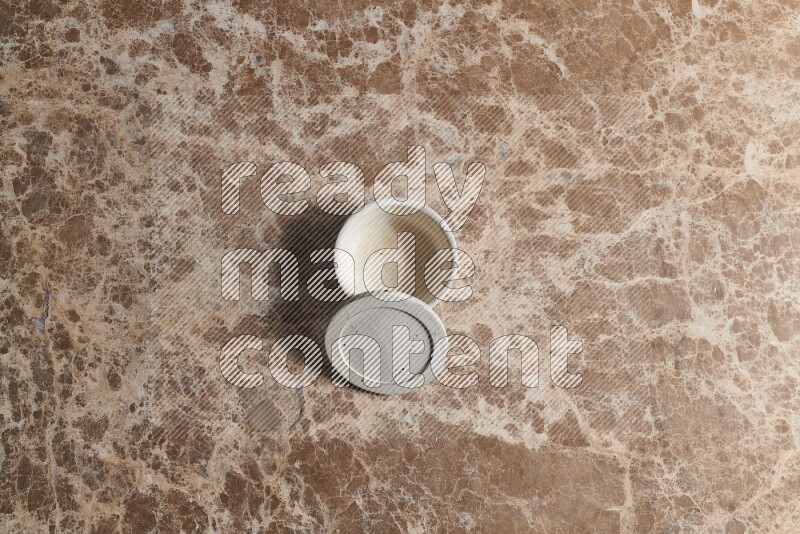 A pottery cup on beige marble background