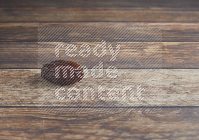 one madjoul date on a wooden background