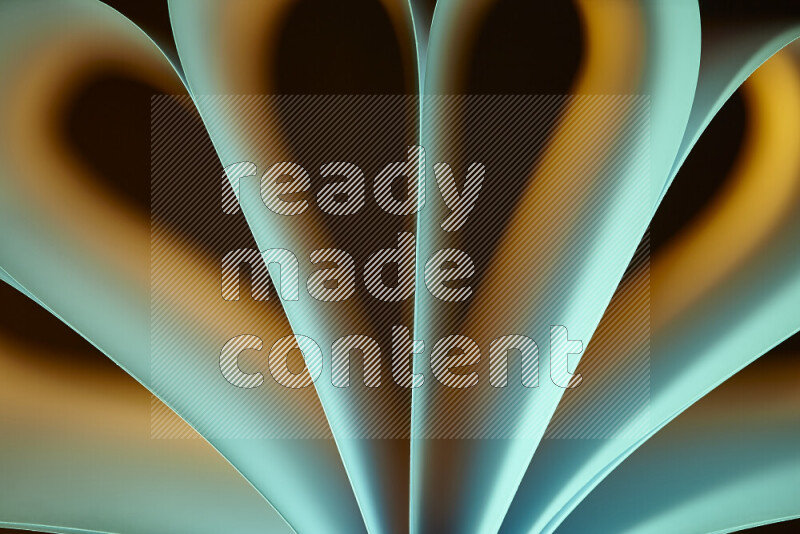 An abstract art piece displaying smooth curves in yellow and green gradients created by colored light