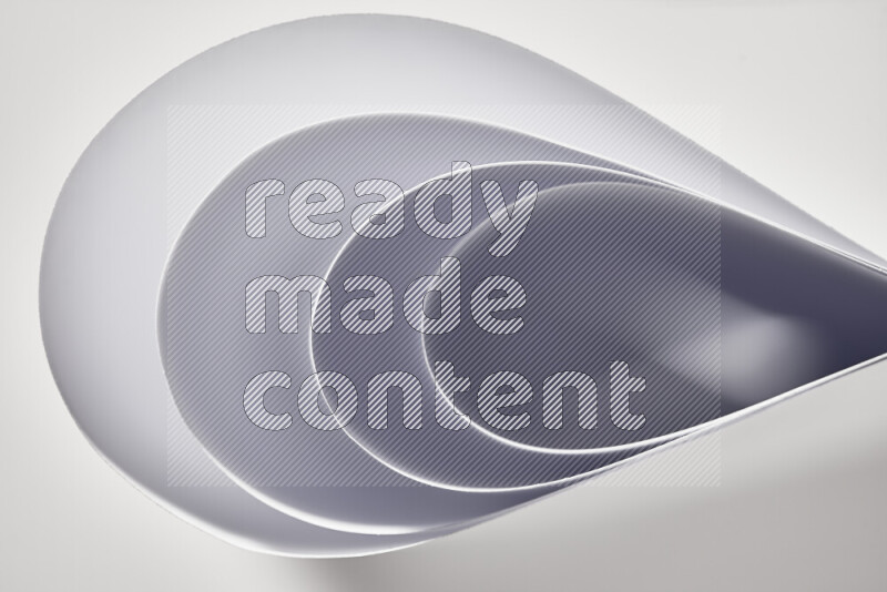 An abstract art of paper folded into smooth curves in grey gradients