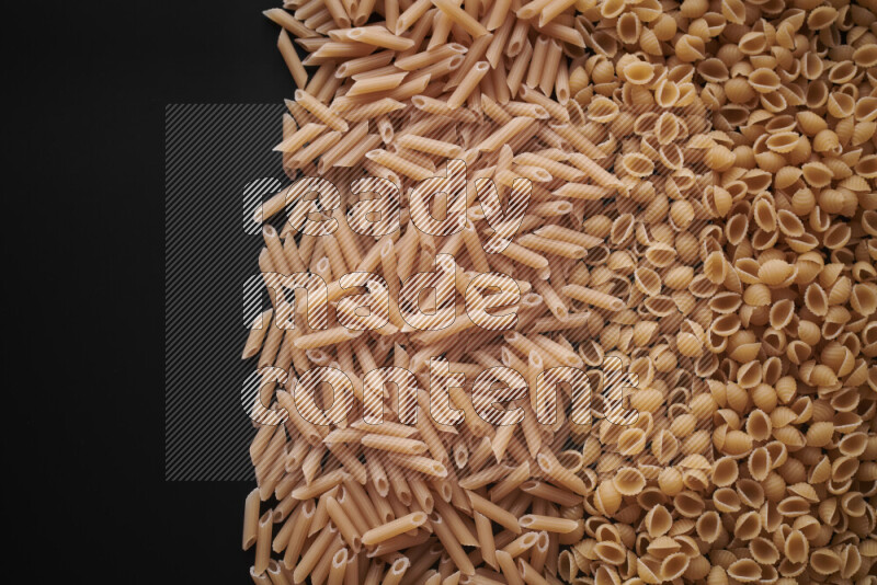 Different pasta types on black background