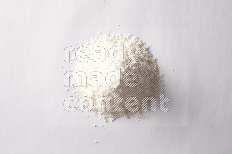 Desiccated coconuts on white background