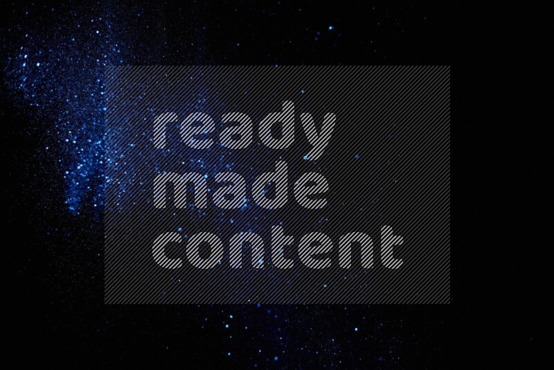 Blue glitter powder isolated on black background