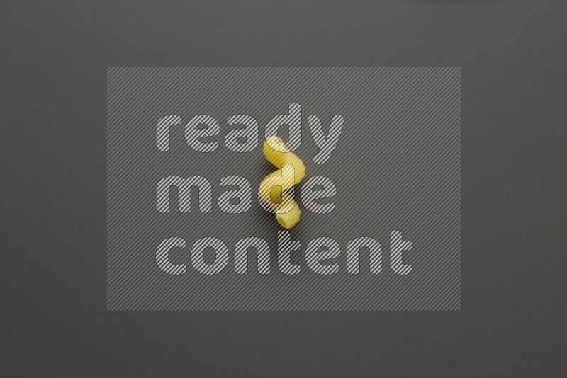 Twist pasta on grey background