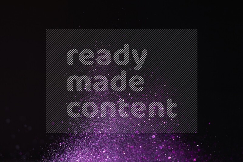 Purple glitter powder isolated on black background