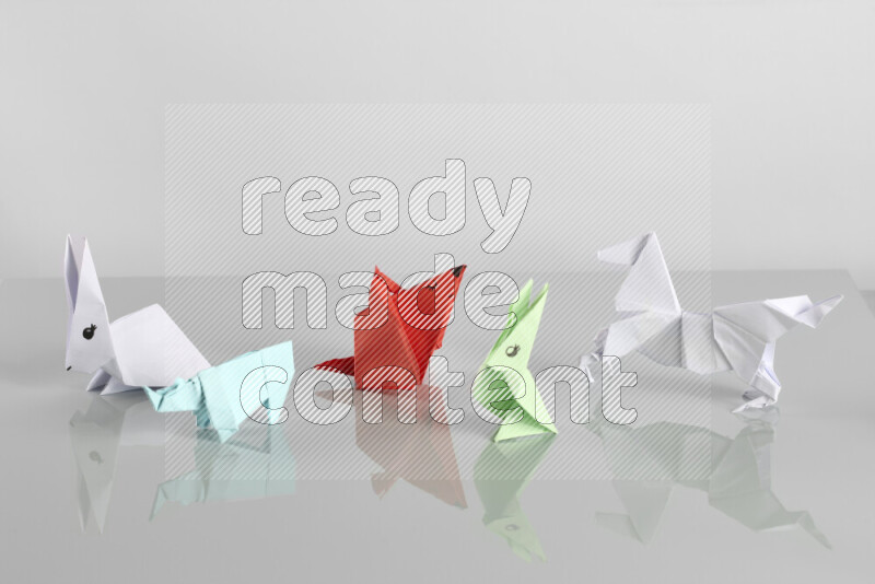 Origami animals on grey background