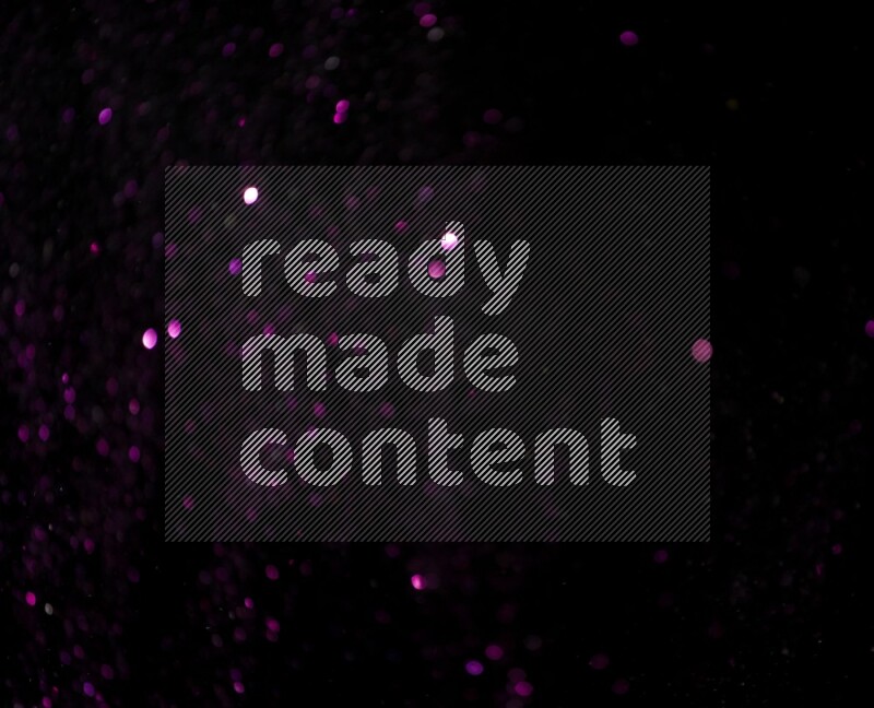 Pink glitter powder isolated on black background