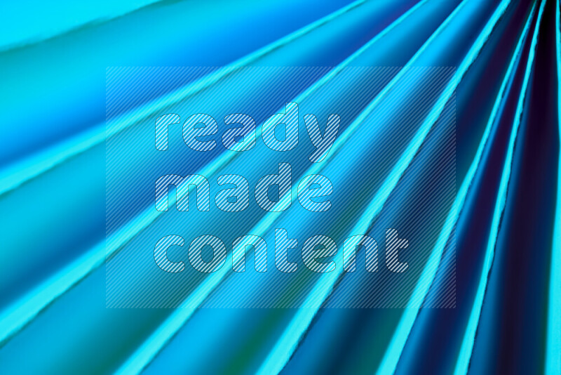 An image presenting an abstract paper pattern of lines in blue tones