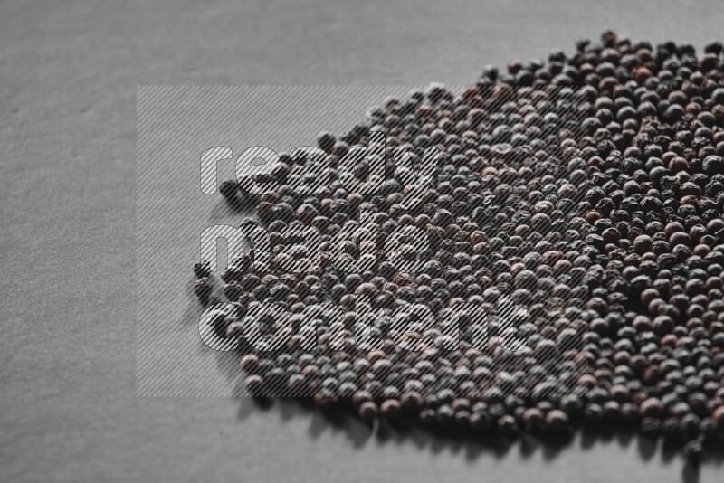 Black pepper on a black flooring