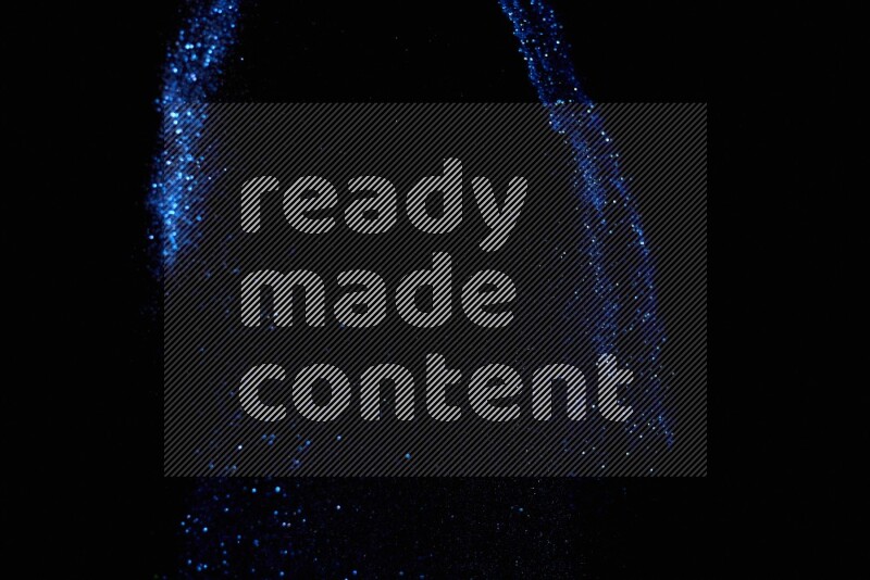 Blue glitter powder isolated on black background