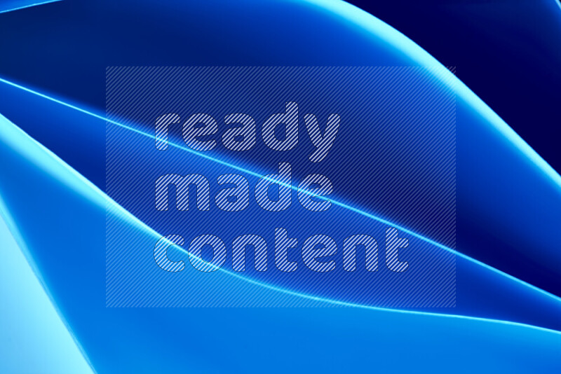 This image showcases an abstract paper art composition with paper curves in blue gradients created by colored light