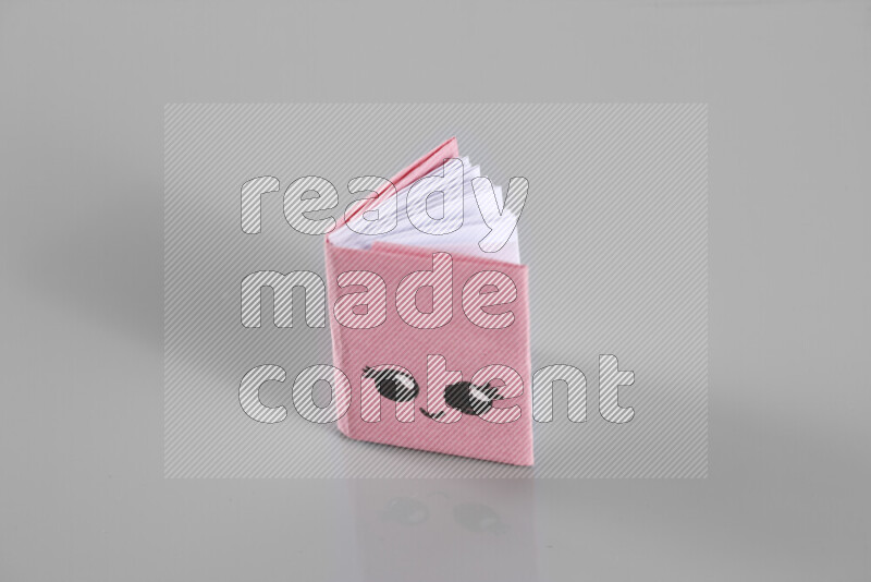 Origami book on grey background
