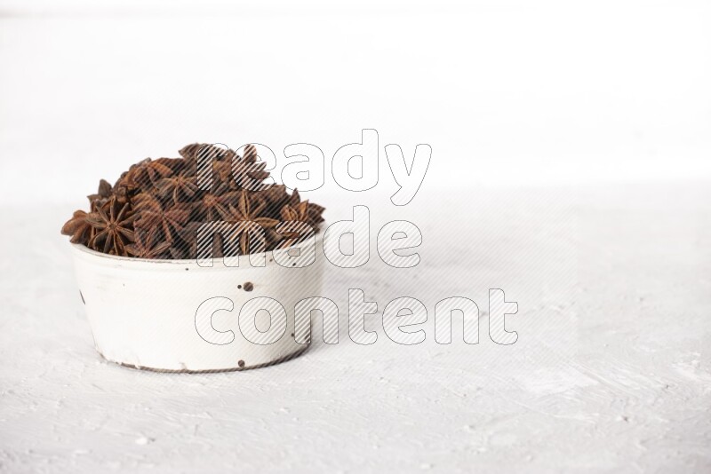 Star Anise in a white bowl on white background
