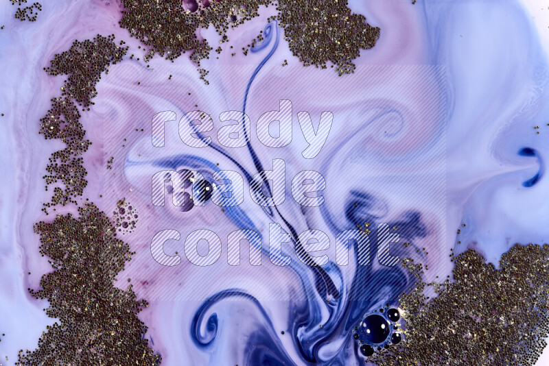 A close-up of sparkling gold glitter scattered on swirling blue and red background