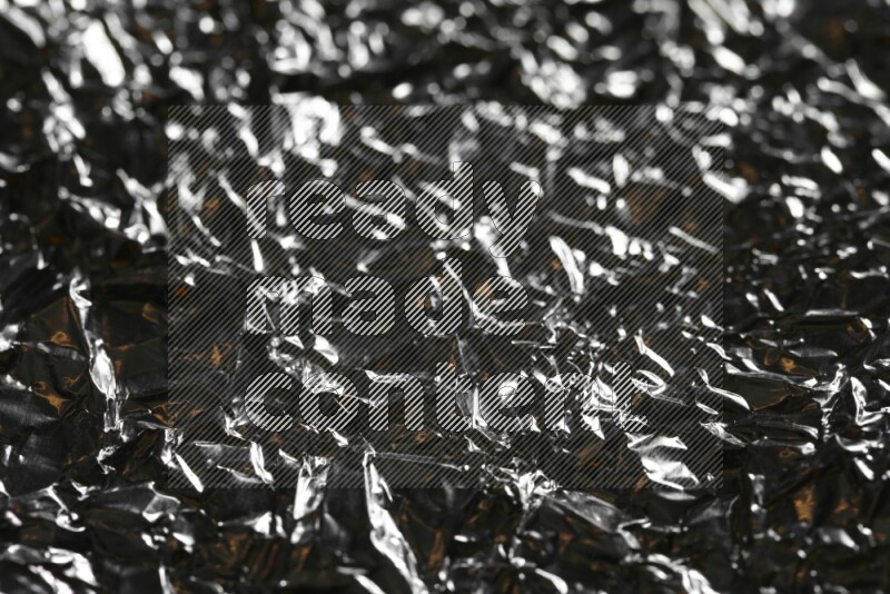 Aluminium foil on black background