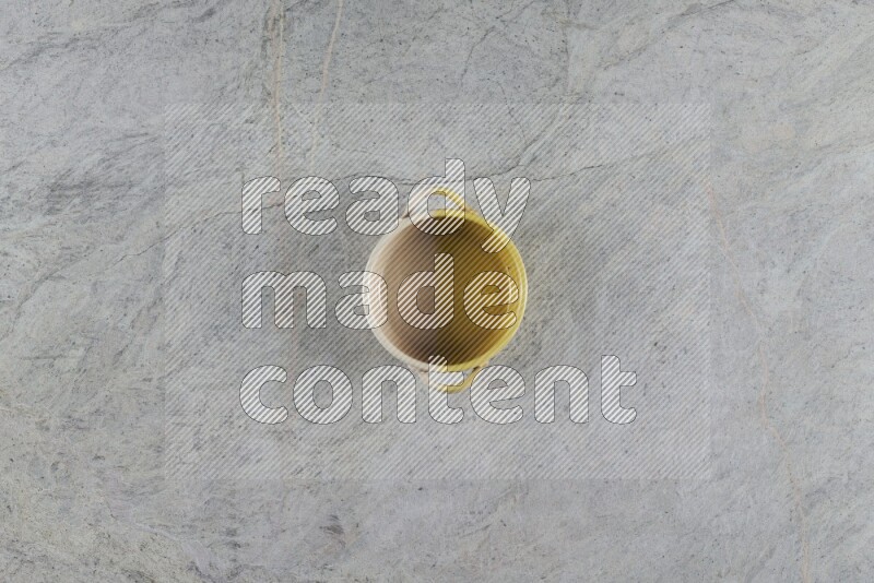 A multicolored pottery Bowl on grey marble background