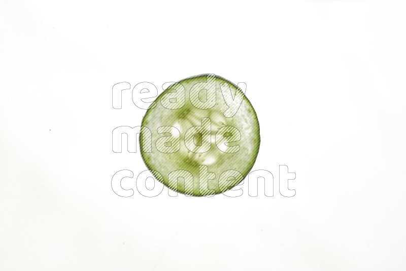 Cucumber slices on illuminated white background