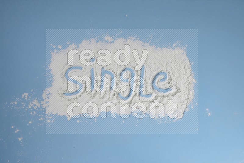 A word written with powder on blue background