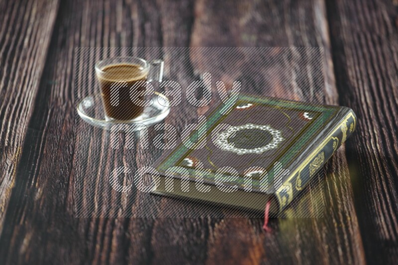 Quran with dates, prayer beads and different drinks all placed on wooden background